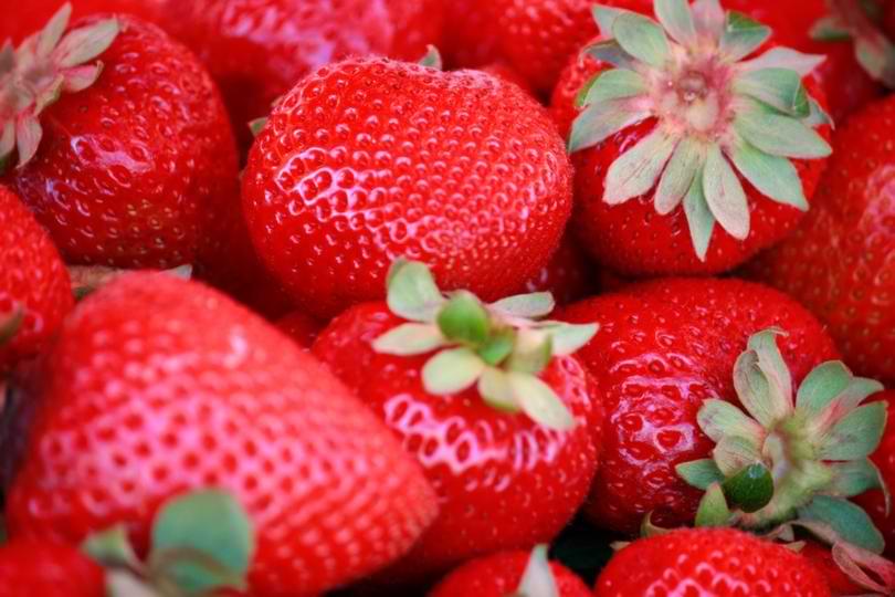 Ripe Red Strawberries Peniche Market Close-up of fresh, bright red strawberries sold at a local market stall in Peniche, Portugal.