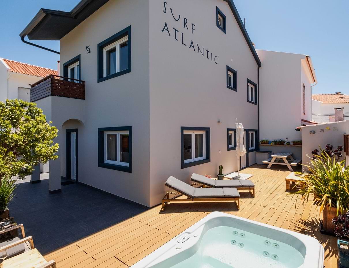 Surf Atlantic Holiday Surf House Exterior Exterior of Surf Atlantic holiday surf house rental in Baleal, Peniche with private garden patio and hot tub.
