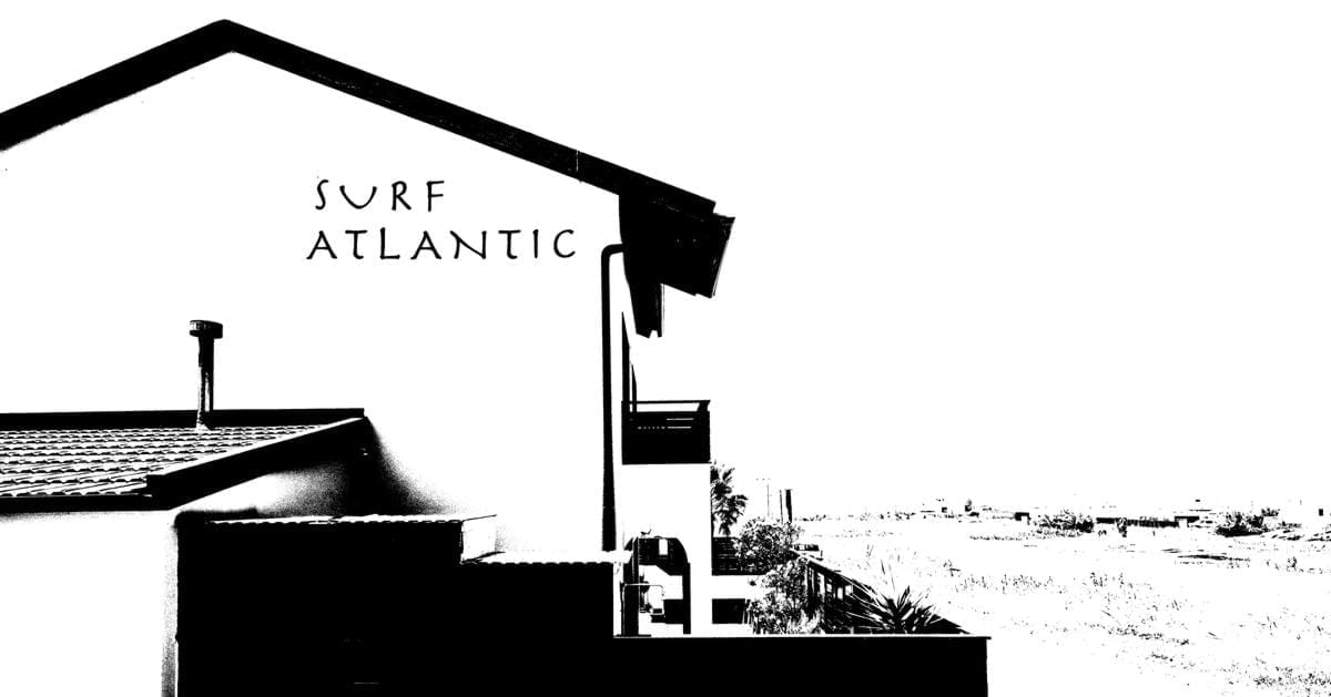 High-contrast graphic of the Surf Atlantic surf house building and coastal landscape.